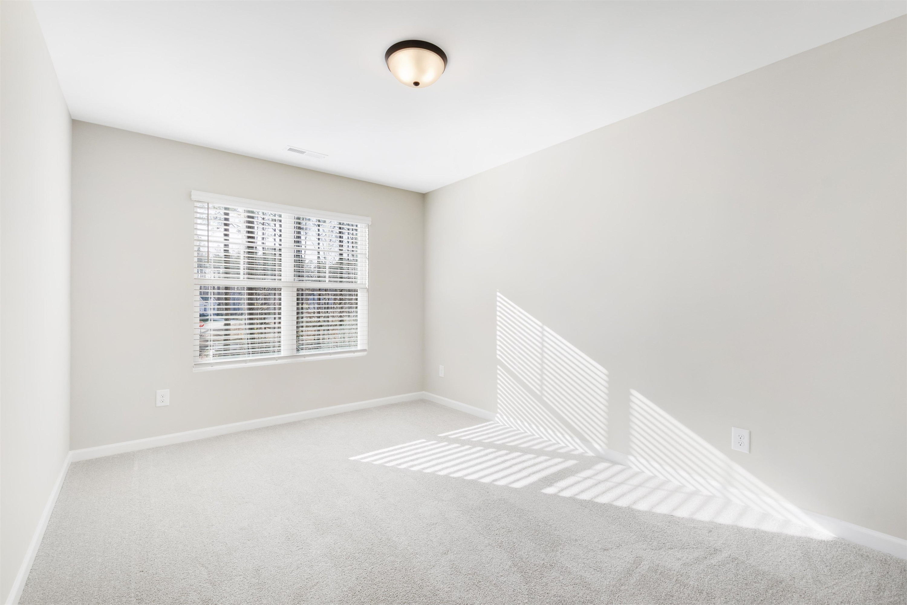 372 Nickleby Way Wendell, NC 27591 - Photo 21 of 37 an empty room with a window