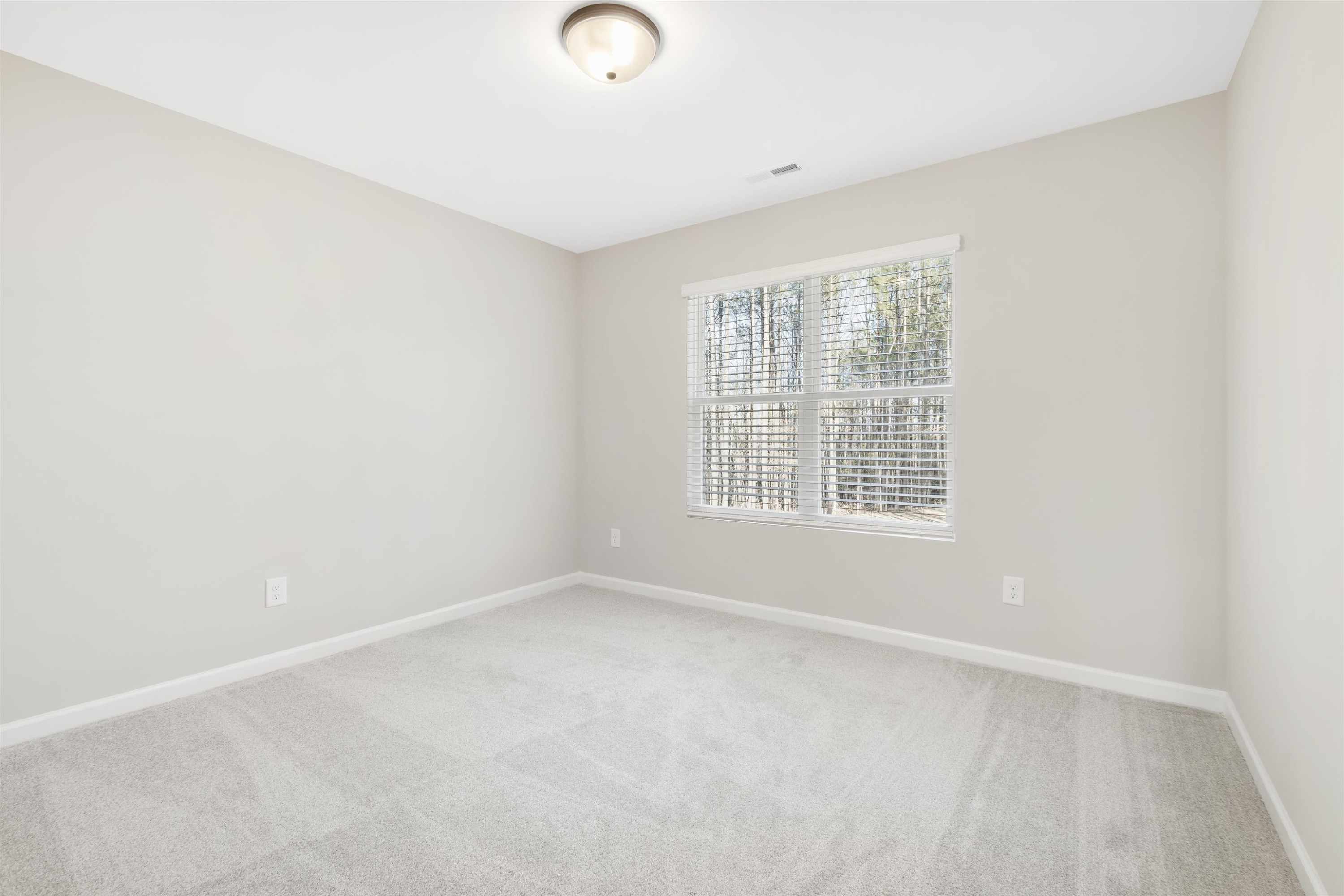 372 Nickleby Way Wendell, NC 27591 - Photo 23 of 37 an empty room with a window