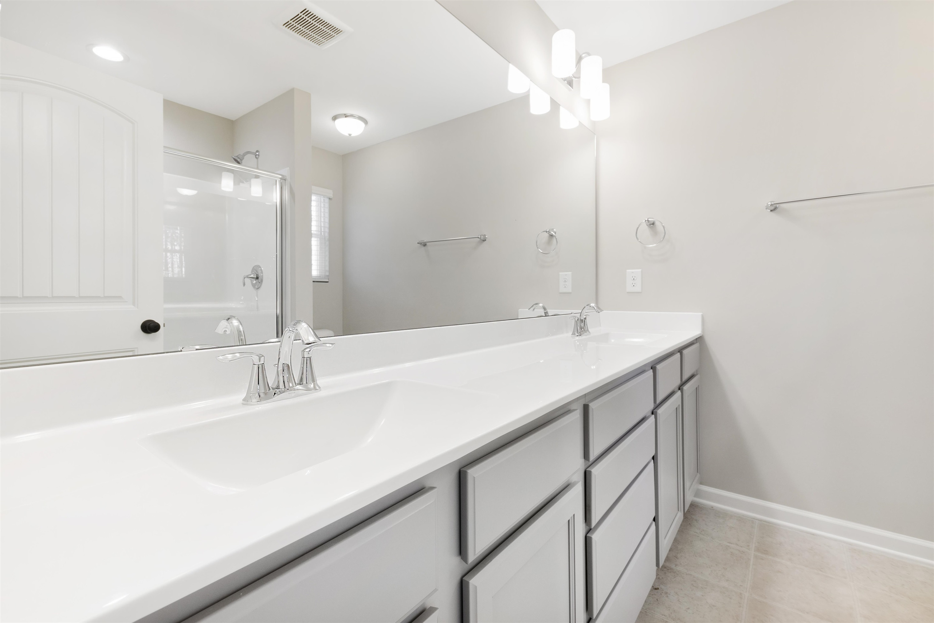 372 Nickleby Way Wendell, NC 27591 - Photo 28 of 37 a bathroom with a sink a vanity and a mirror