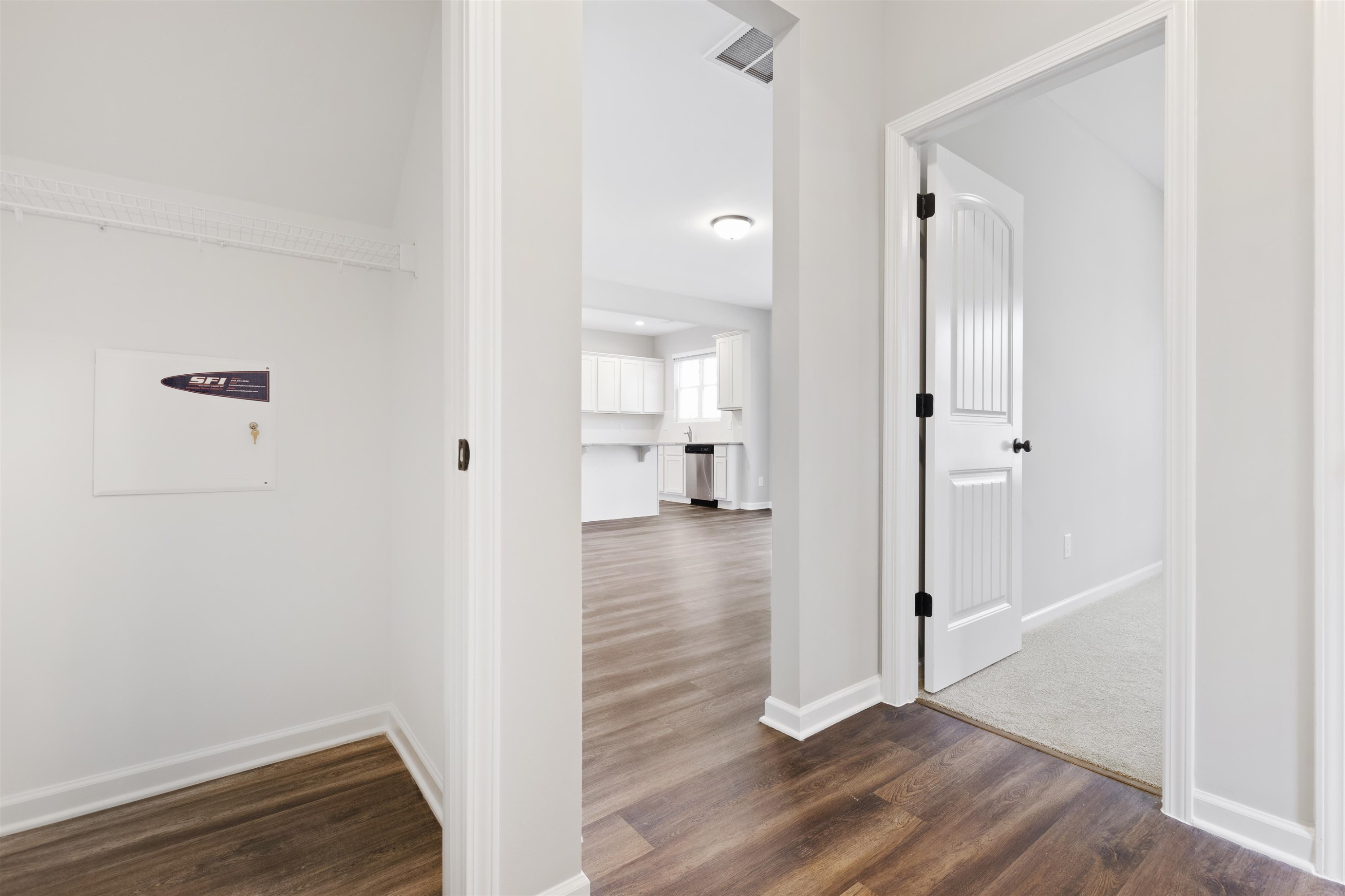 372 Nickleby Way Wendell, NC 27591 - Photo 6 of 37 a view of a hallway with wooden floor