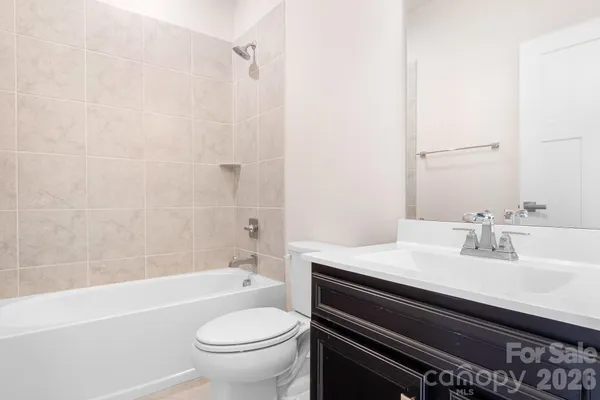 a bathroom with a sink a toilet and a bathtub