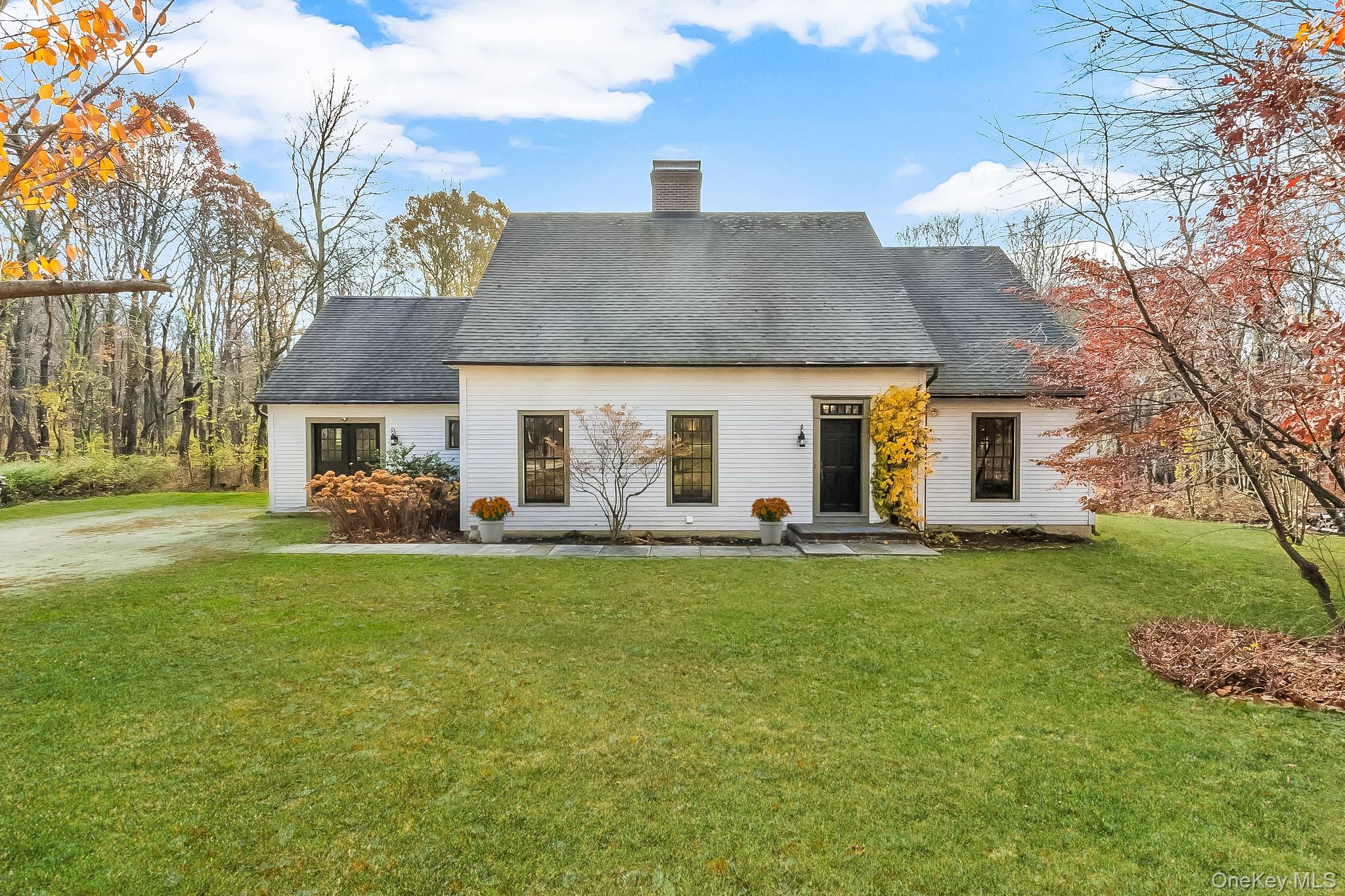 331 Grape Hollow Road Holmes, NY 12531 - Photo 1 of 1 a front view of a house with a garden