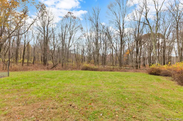 a view of outdoor space with deck and yard