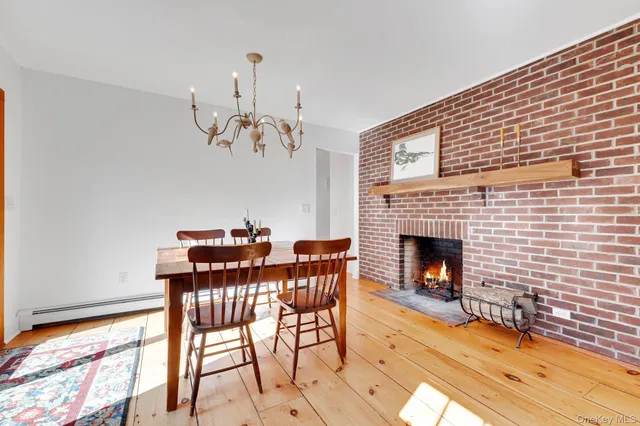 a view of a livingroom with furniture and a fireplace