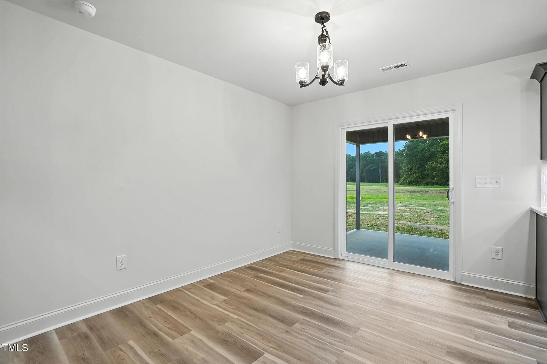 8670 Green Path Road Dunn, NC 28334 - Photo 21 of 34 a view of an empty room with a window