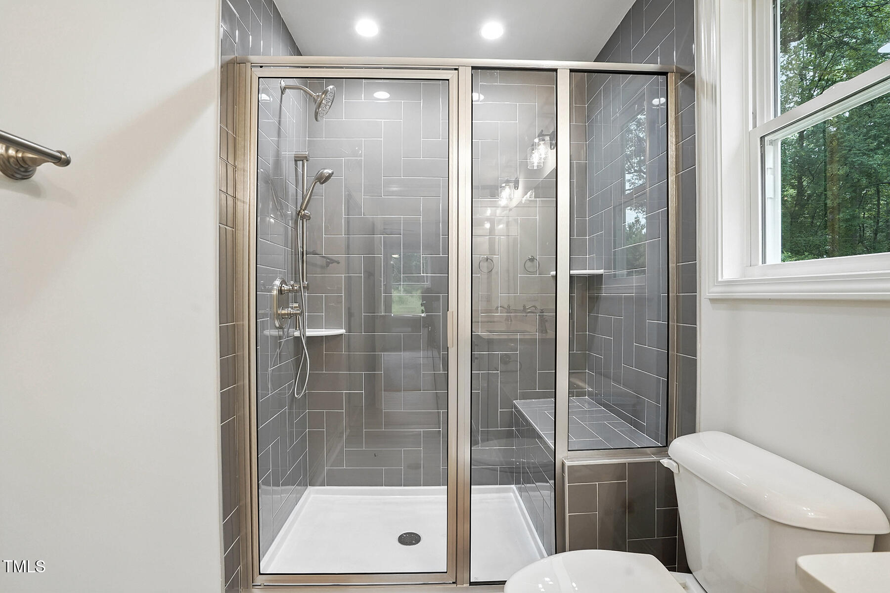 8670 Green Path Road Dunn, NC 28334 - Photo 26 of 34 a bathroom with a shower a toilet and a glass door shower