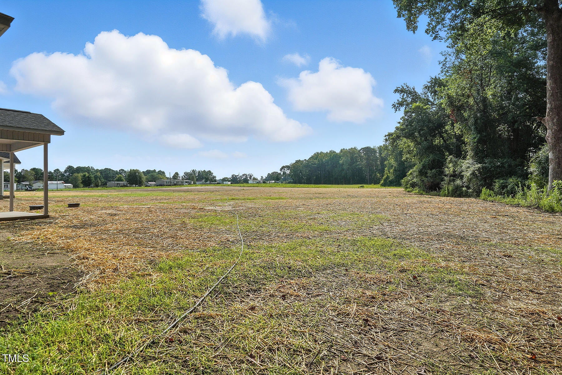 8670 Green Path Road Dunn, NC 28334 - Photo 30 of 34 a view of a lake and a yard