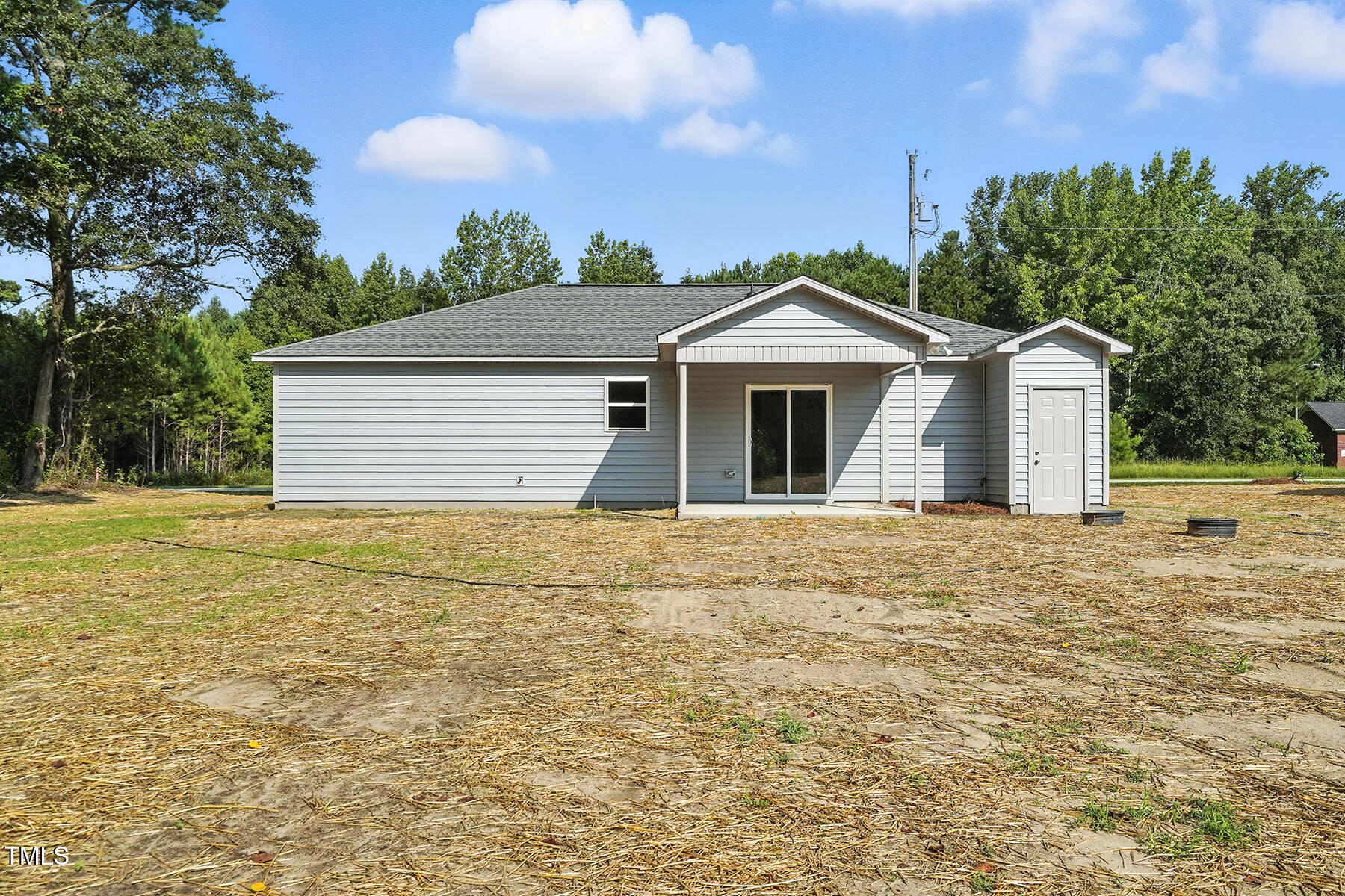 8670 Green Path Road Dunn, NC 28334 - Photo 33 of 34 a front view of a house with a garden
