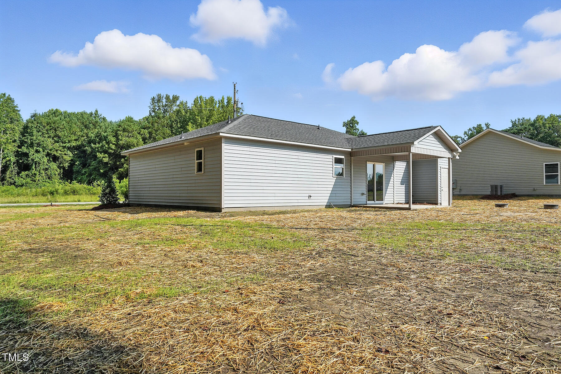 8670 Green Path Road Dunn, NC 28334 - Photo 34 of 34 a front view of house with yard and entertaining space