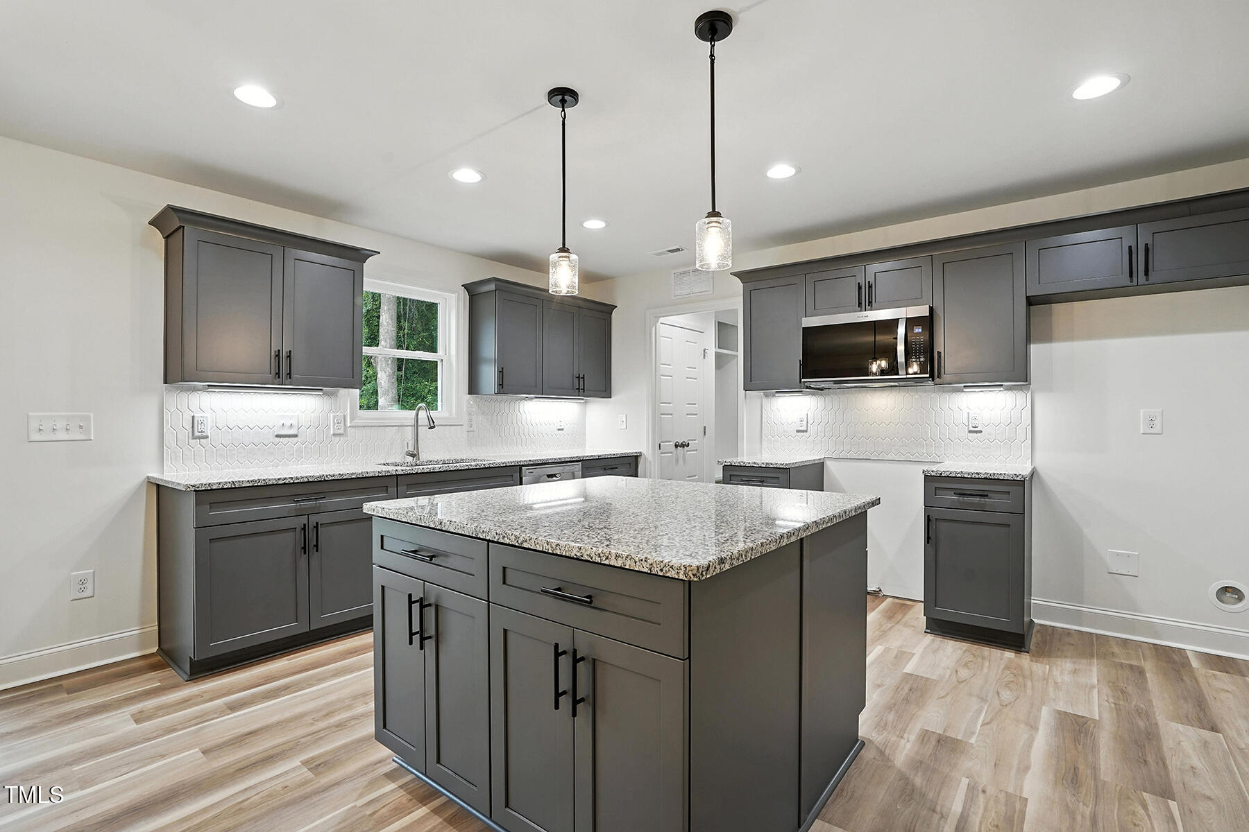 8670 Green Path Road Dunn, NC 28334 - Photo 9 of 34 a kitchen with a sink stove and refrigerator