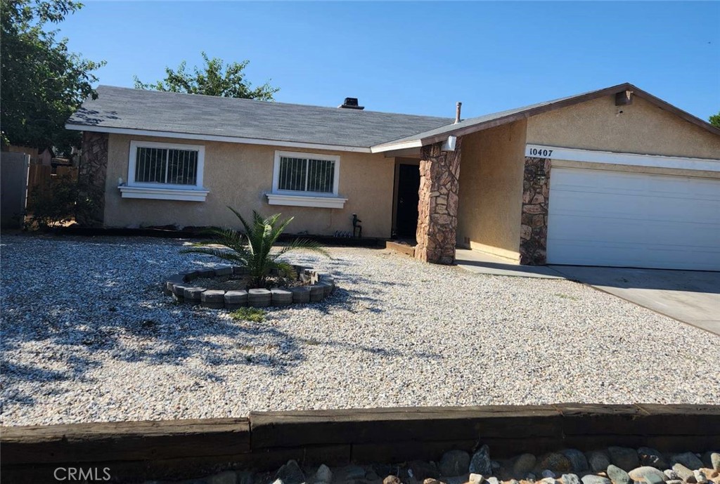 10407 Rodeo Circle Adelanto, CA 92301 - Photo 1 of 1 a view of a house with a yard
