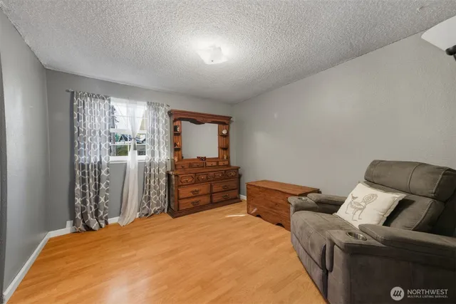 a bed room with a bed and a television