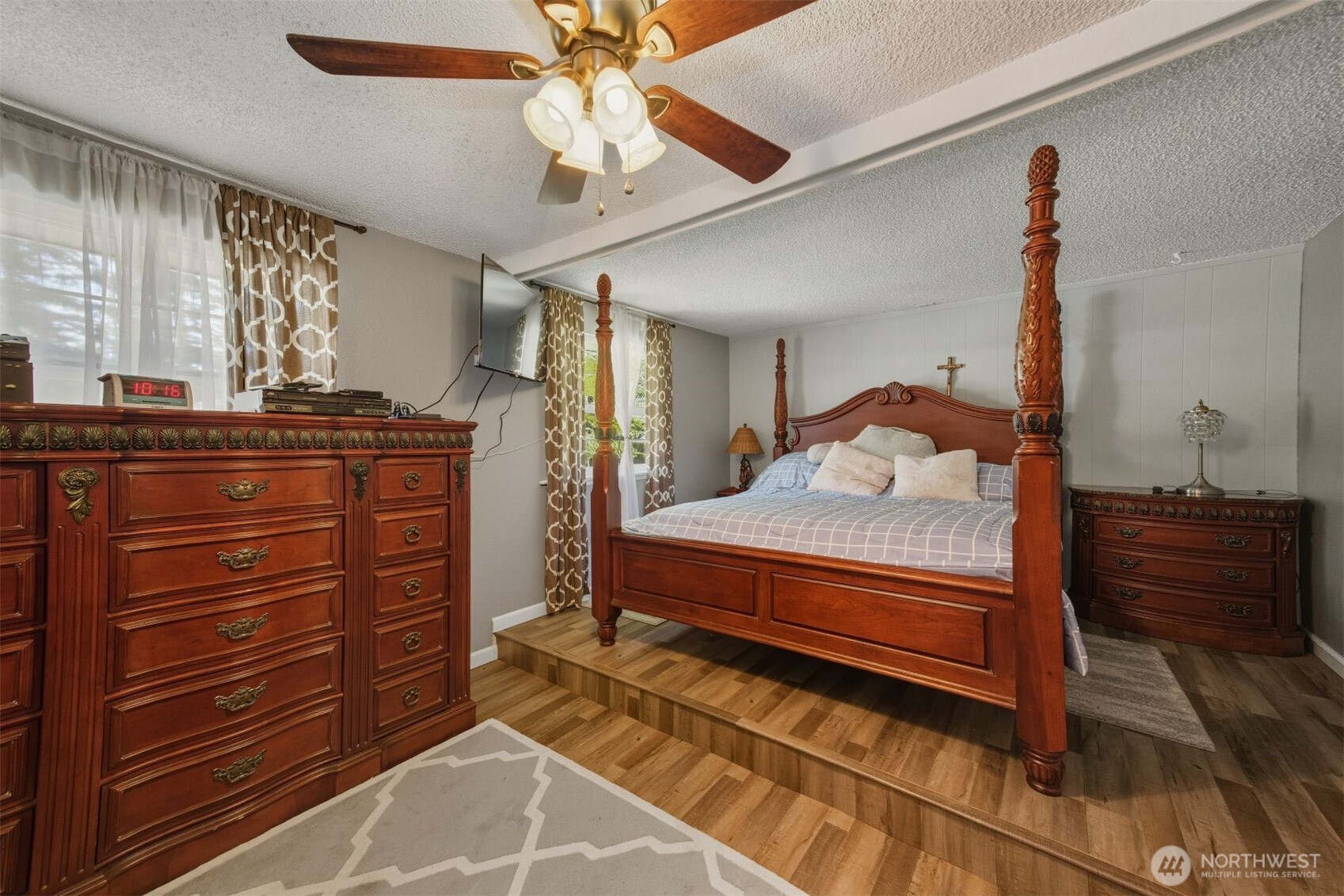 3648 Birch Terrace Court Custer, WA 98240 - Photo 16 of 28 a bedroom with a bed and a chandelier