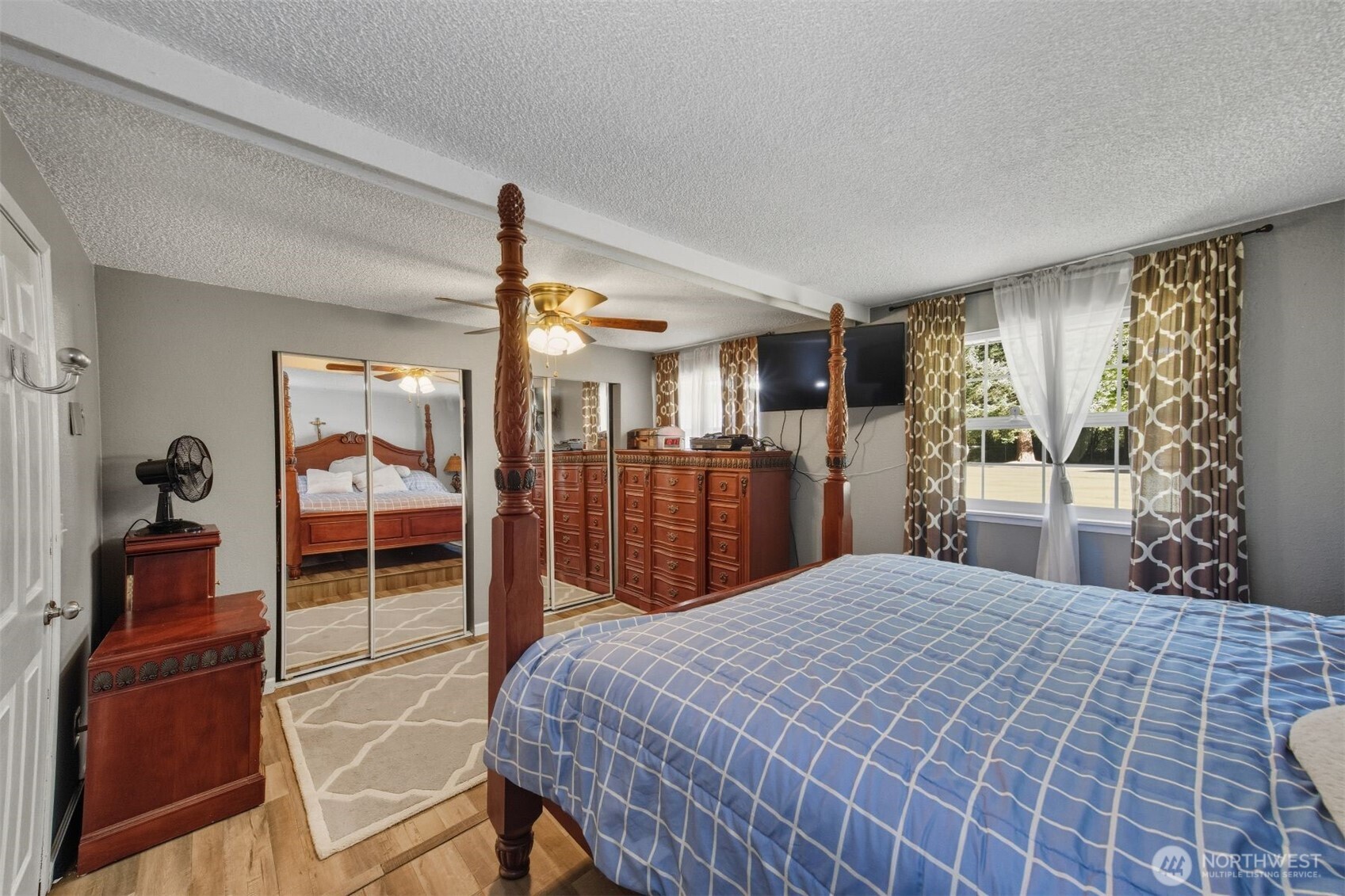 3648 Birch Terrace Court Custer, WA 98240 - Photo 17 of 28 a bedroom with a large bed and a chandelier