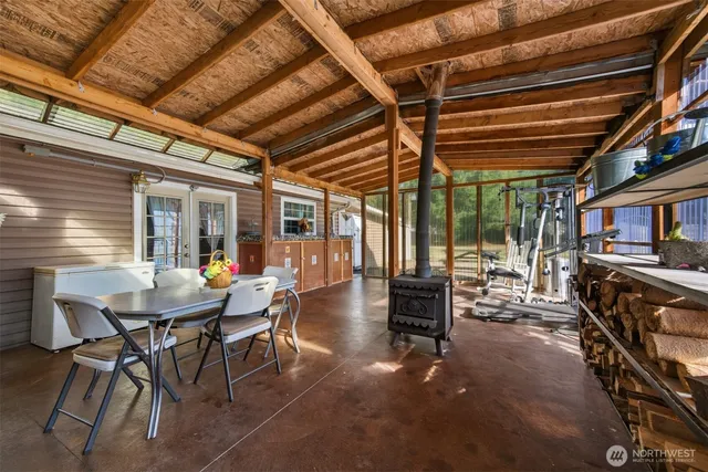 a view of a patio with table and chairs and potted plants