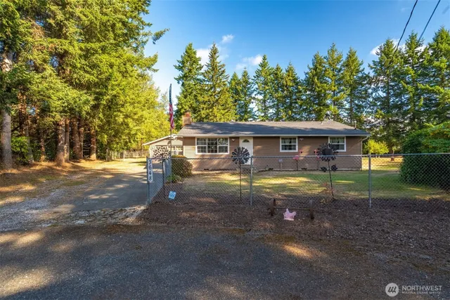 a front view of house with yard slide and outdoor seating