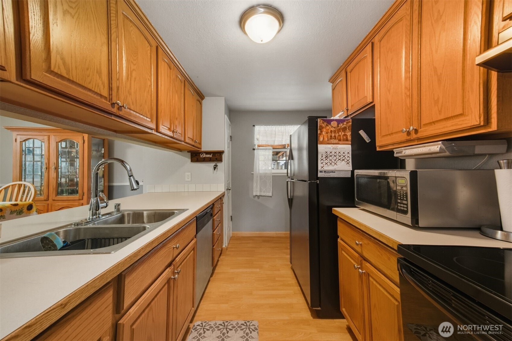 3648 Birch Terrace Court Custer, WA 98240 - Photo 9 of 28 a kitchen with stainless steel appliances granite countertop a sink and a refrigerator