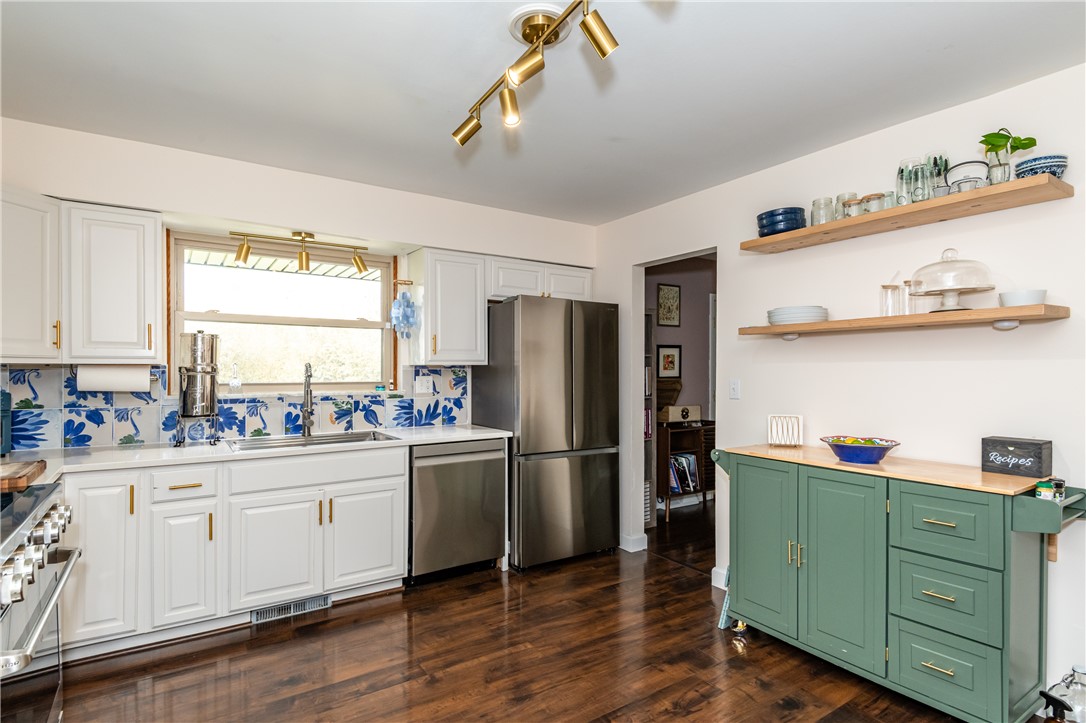 4102 Ridgetop Drive Bellbrook, OH 45305 - Photo 6 of 33 This spacious kitchen offers ample storage and modern appliances perfect for culinary pursuits.