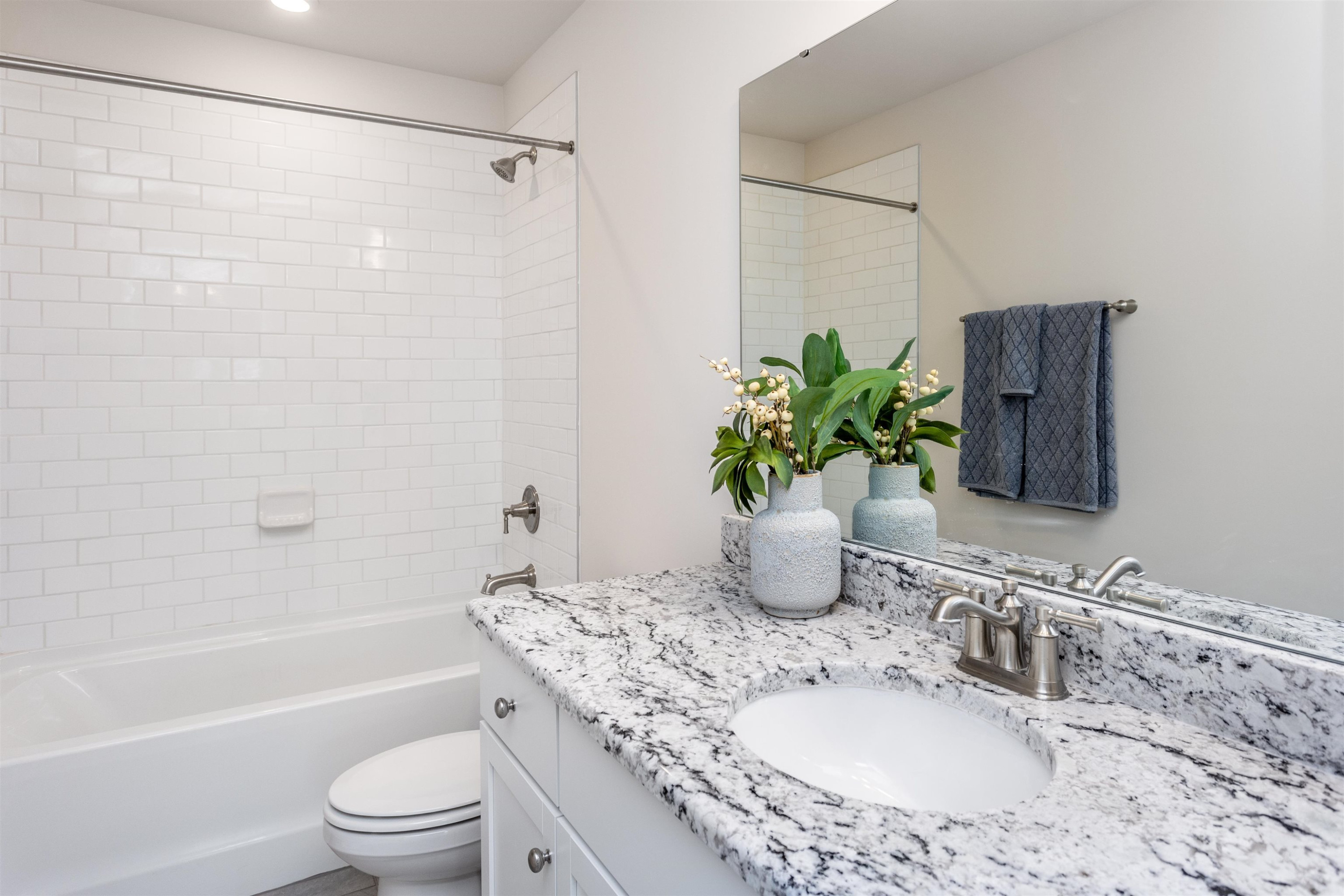 3425 Pinnacle Peak Drive Raleigh, NC 27604 - Photo 15 of 23 a bathroom with a granite countertop sink a toilet a mirror a shower and vanity