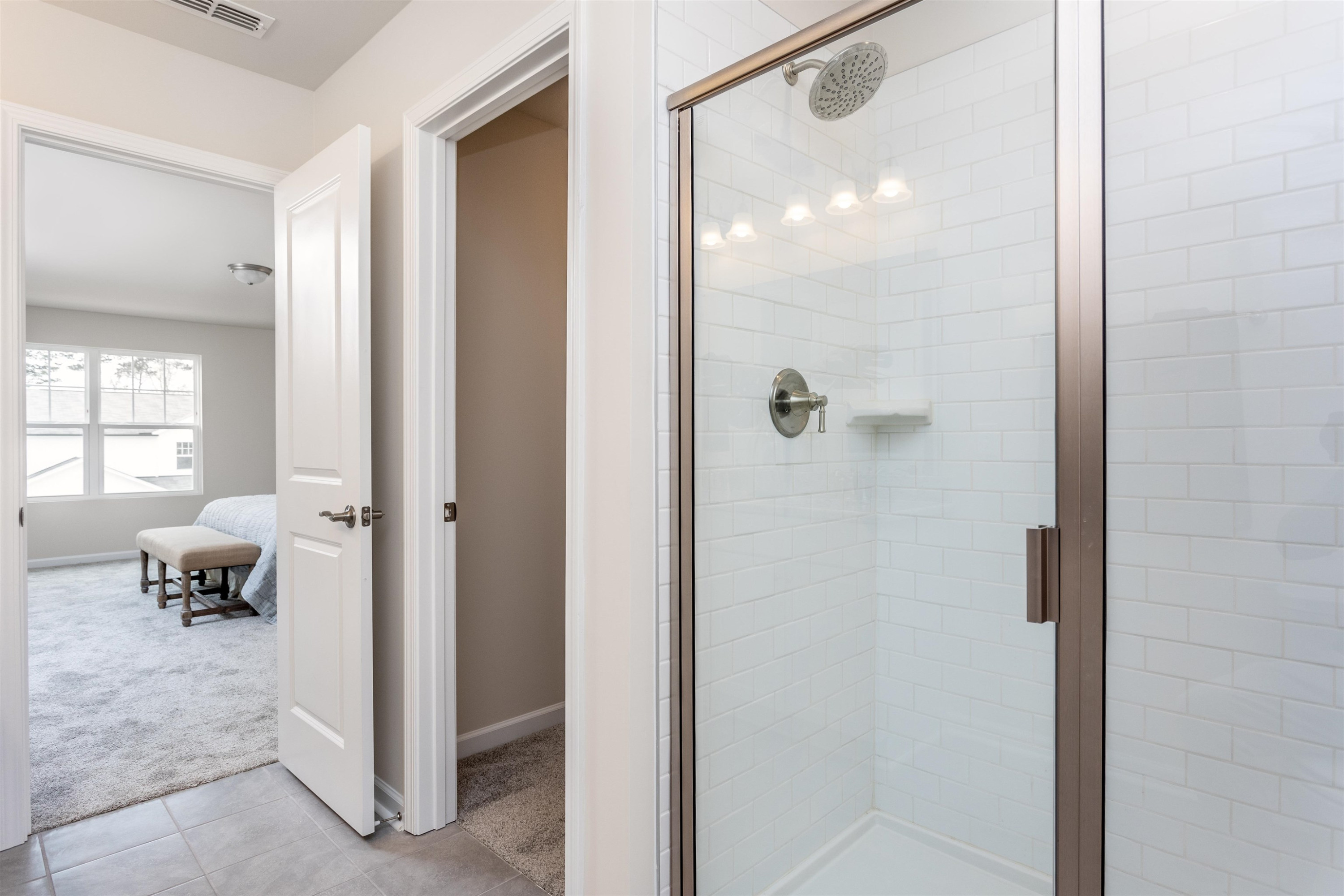 3425 Pinnacle Peak Drive Raleigh, NC 27604 - Photo 19 of 23 a bathroom with a glass shower door and a mirror