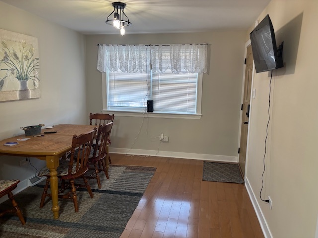 5131 Latrobe Avenue Chicago, IL 60638 - Photo 11 of 23 a view of a dining room with furniture and a window
