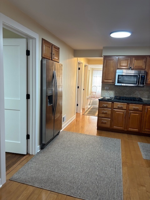 5131 Latrobe Avenue Chicago, IL 60638 - Photo 13 of 23 a large kitchen with stainless steel appliances granite countertop a refrigerator and a sink