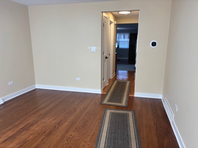 5131 Latrobe Avenue Chicago, IL 60638 - Photo 4 of 23 wooden floor with a bench