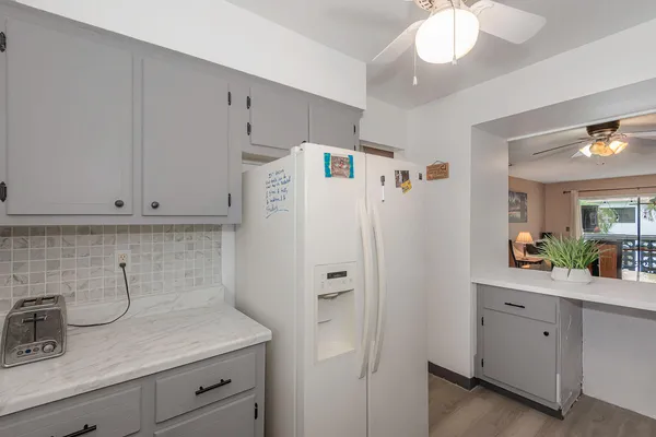 a view of a kitchen with cabinets