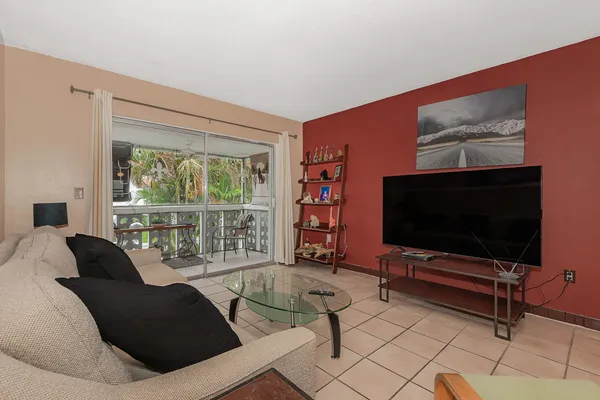 a living room with furniture and a flat screen tv