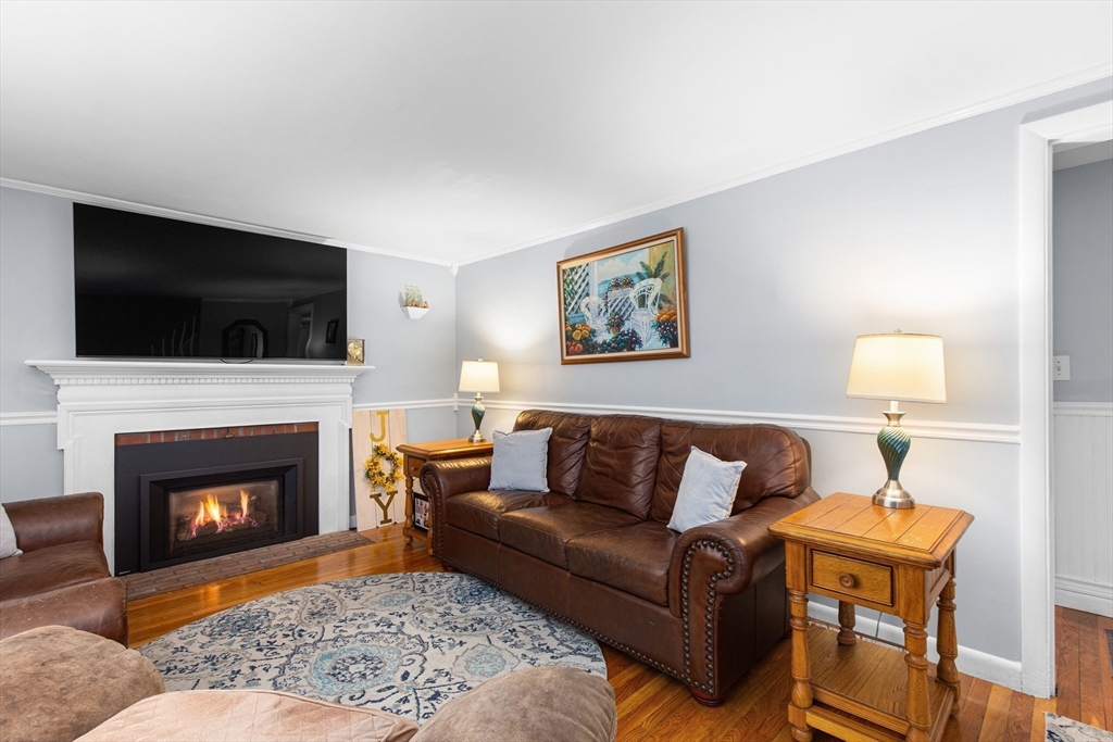 22 Baker Street Brockton, MA 02302 - Photo 11 of 32 a living room with furniture and a fireplace