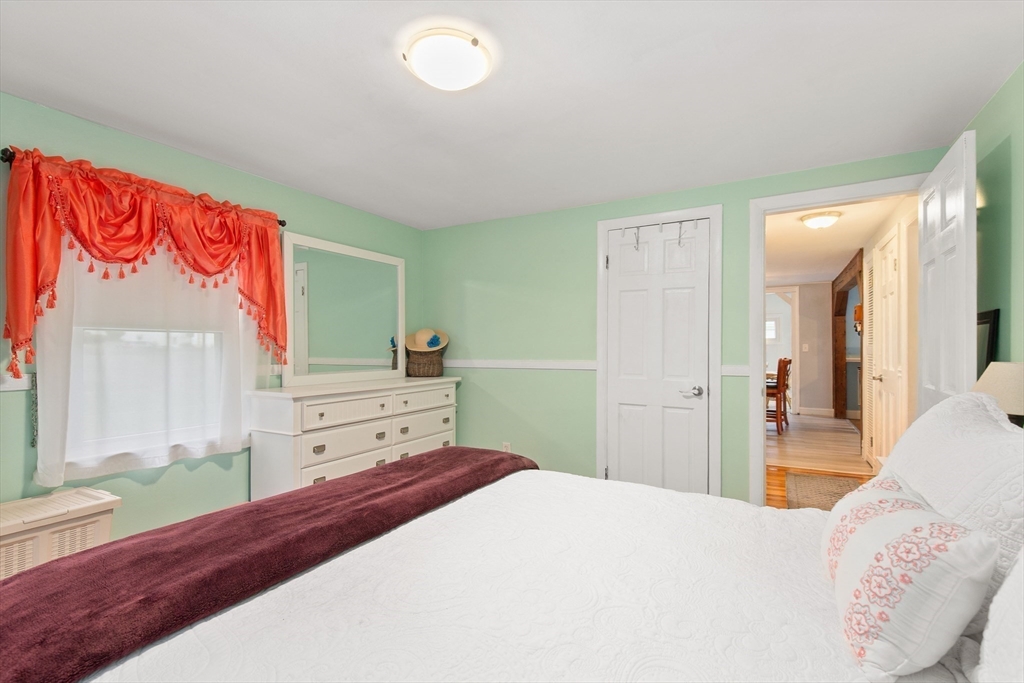 22 Baker Street Brockton, MA 02302 - Photo 15 of 32 a bedroom with a bed and a dresser