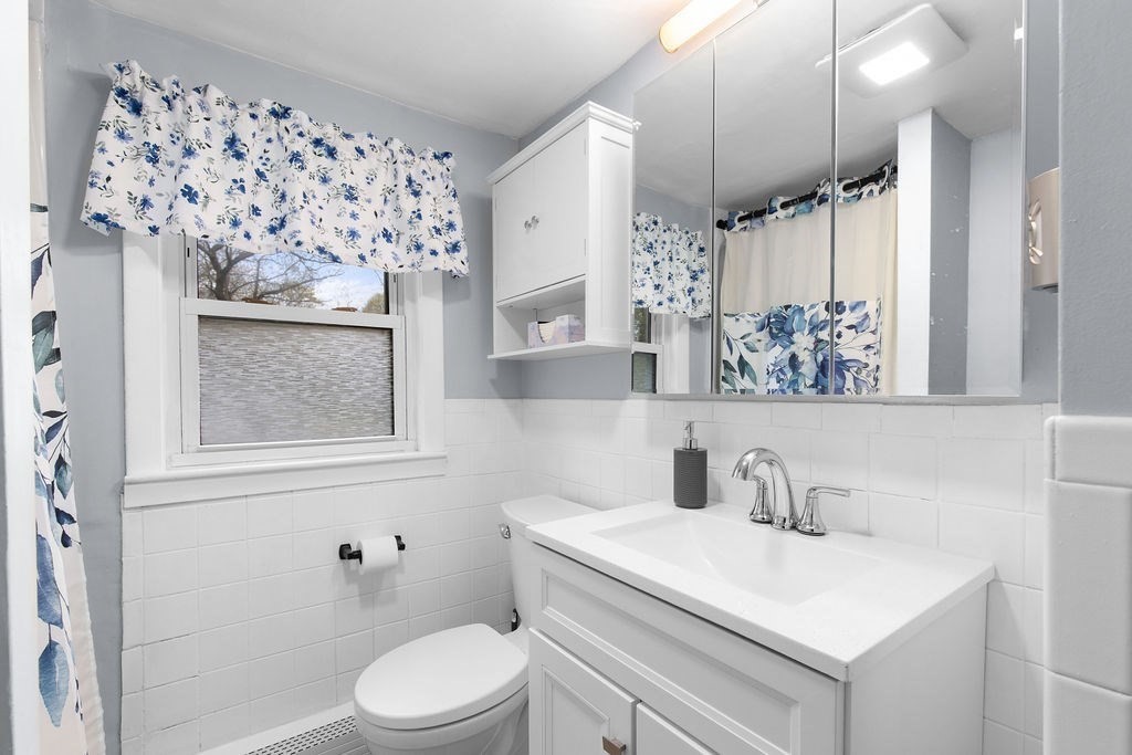 22 Baker Street Brockton, MA 02302 - Photo 21 of 32 a bathroom with a sink toilet and shower