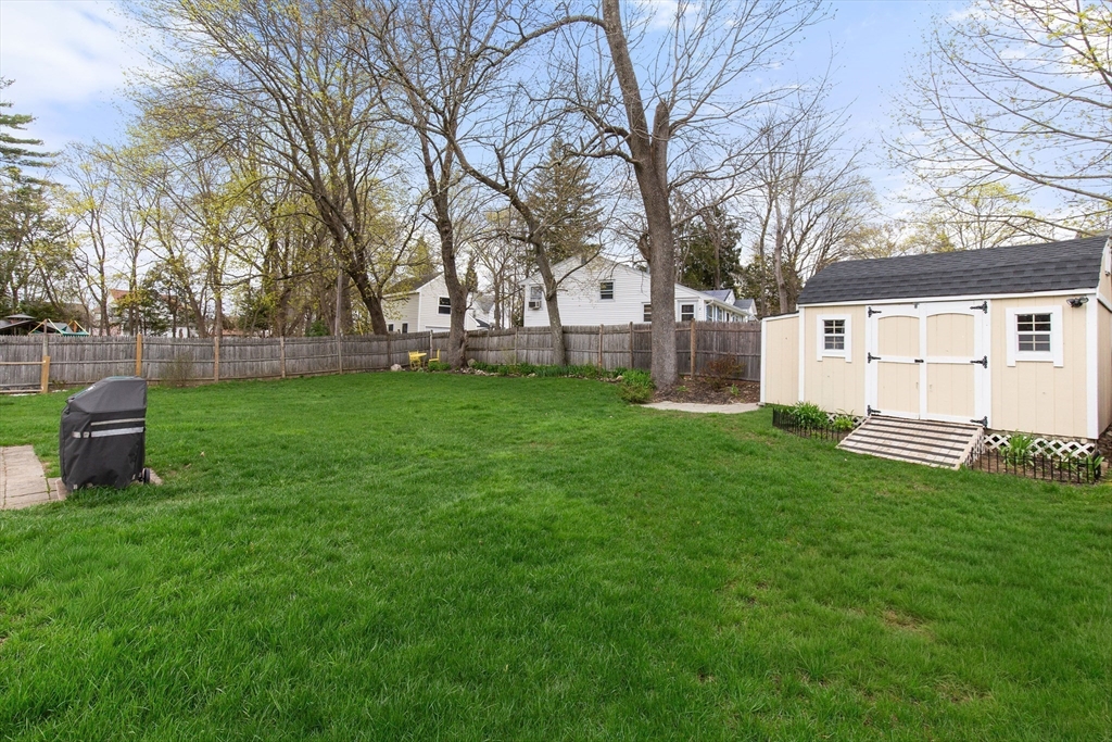 22 Baker Street Brockton, MA 02302 - Photo 28 of 32 a view of a backyard with a white house