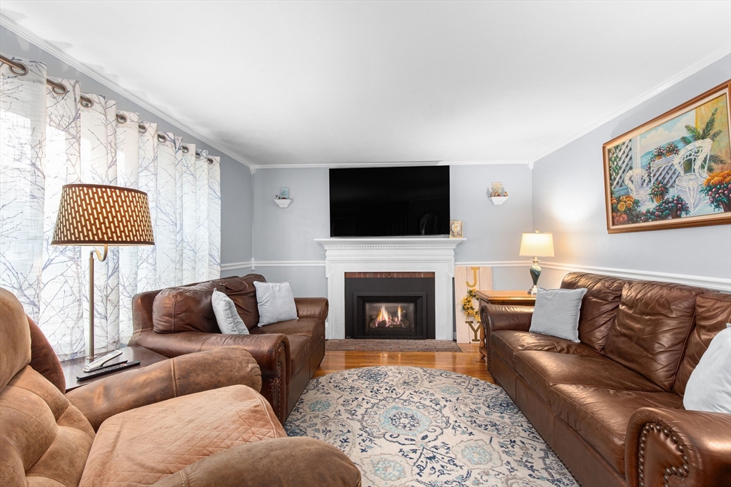 22 Baker Street Brockton, MA 02302 - Photo 9 of 32 a living room with furniture fireplace and window