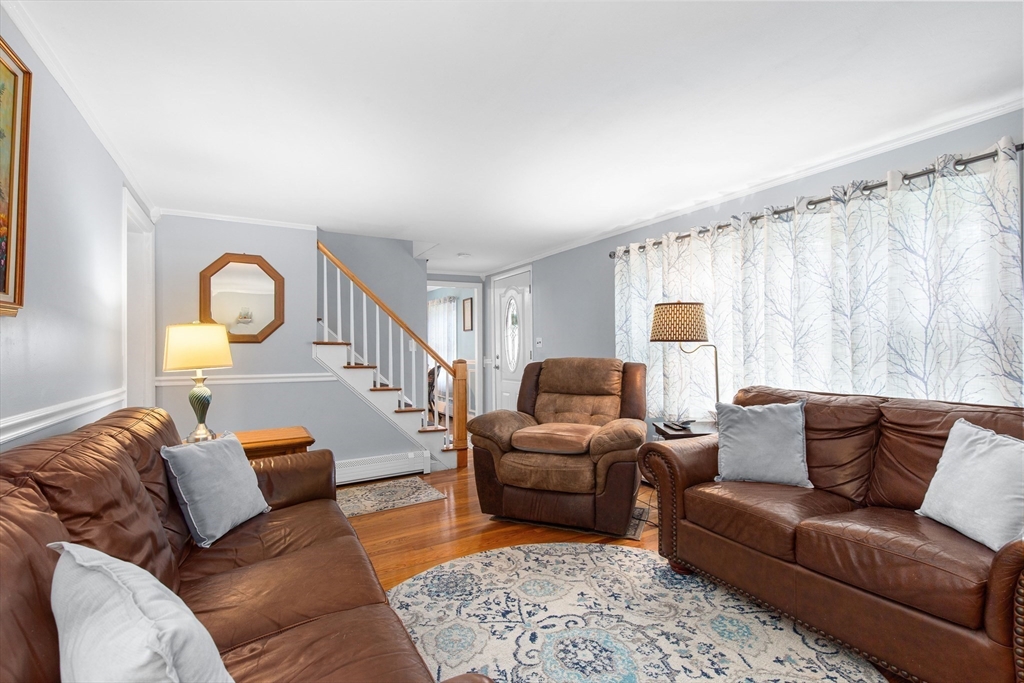22 Baker Street Brockton, MA 02302 - Photo 10 of 32 a living room with furniture fireplace and a window