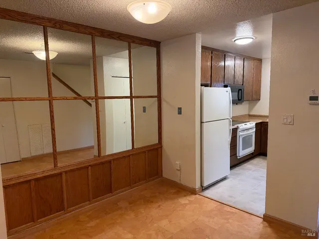 a view of a kitchen with closet area