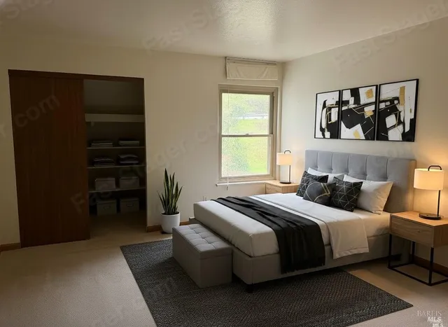 a bedroom with a bed and a window