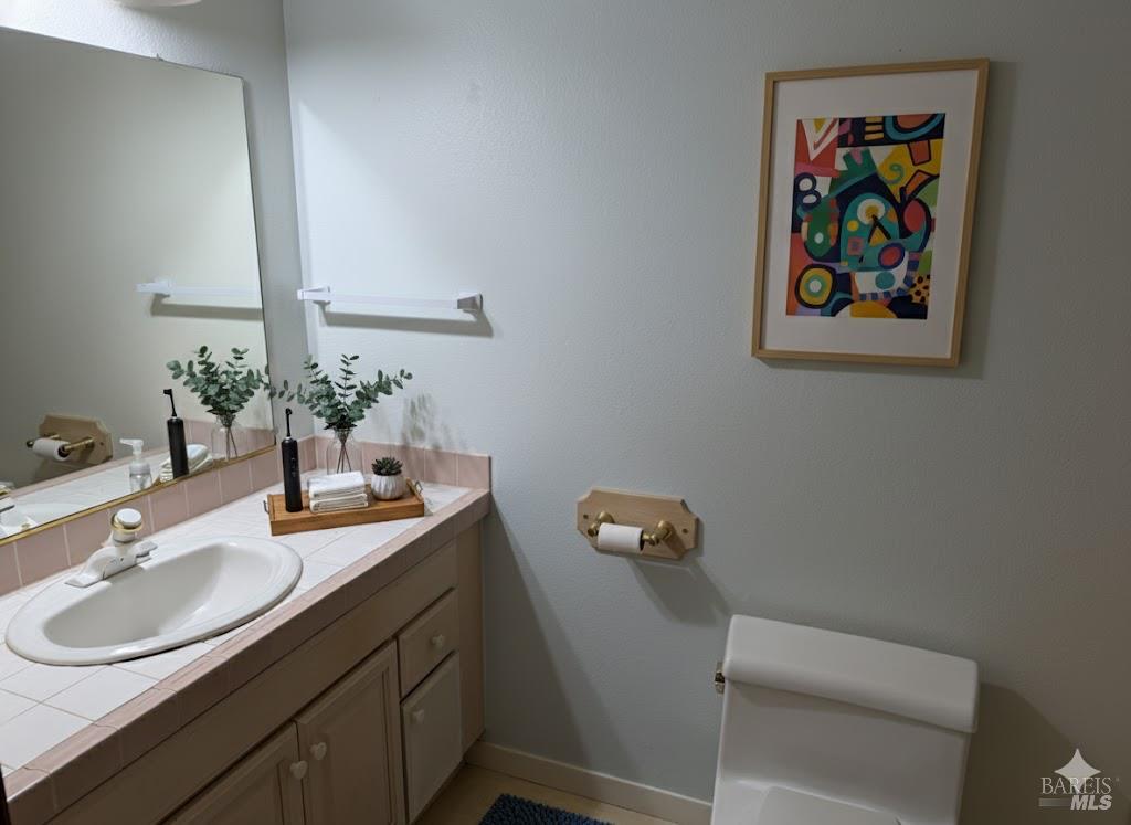 1964 Knolls Drive Santa Rosa, CA 95405 - Photo 31 of 39 a bathroom with a sink mirror and toilet