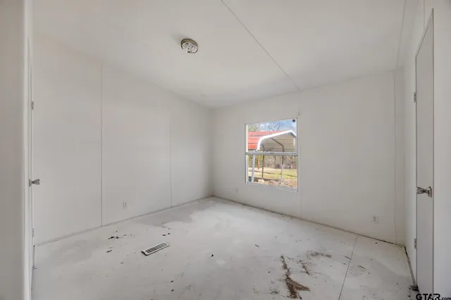 a view of an empty room and window