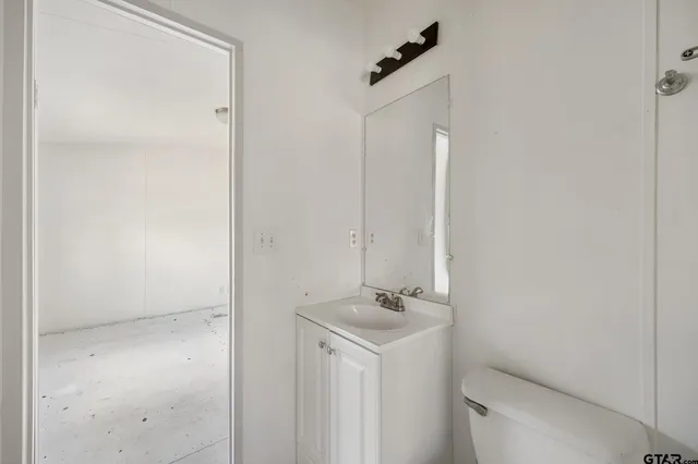 a bathroom with a sink and mirror