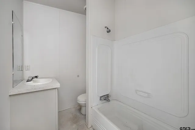 a bathroom with a sink and a toilet