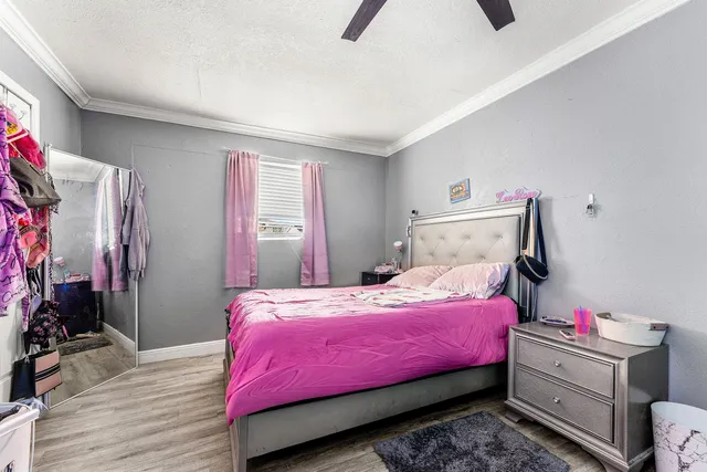 a bedroom with bed and a window