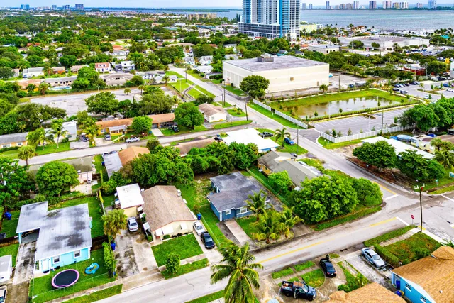 an aerial view of residential houses with outdoor space