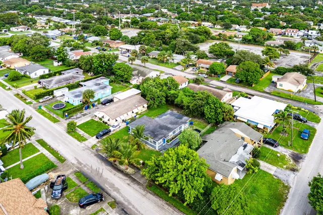 an aerial view of residential houses with outdoor space