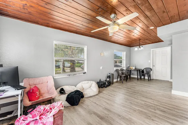 a bedroom with furniture and a window