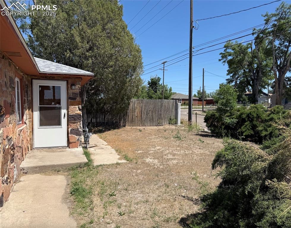 1117 West 6th Street La Junta, CO 81050 - Photo 16 of 18 a view of a house with backyard and tree
