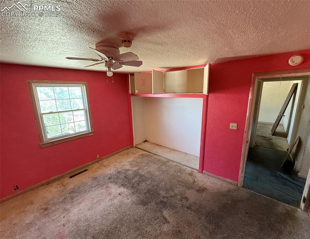 1117 West 6th Street La Junta, CO 81050 - Photo 9 of 18 a view of empty room with a fireplace