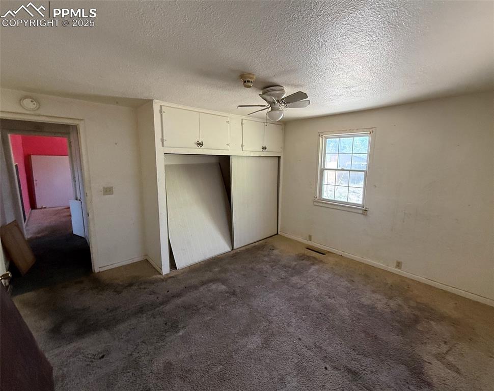 1117 West 6th Street La Junta, CO 81050 - Photo 10 of 18 wooden floor in an empty room with a window