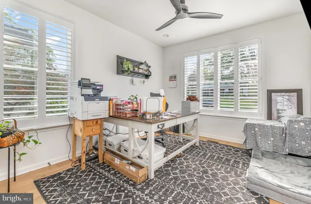 a large kitchen with granite countertop a stove a sink a island and windows