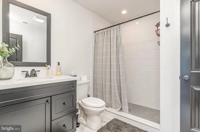 a view of a dining room with furniture a chandelier and wooden floor